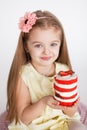 Little kid blonde girl holding a red velvet cake Royalty Free Stock Photo