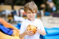 Little kid boy drinking coconut juice on tropical beach Royalty Free Stock Photo