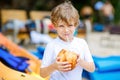 Little kid boy drinking coconut juice on tropical beach Royalty Free Stock Photo