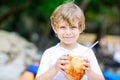 Little kid boy drinking coconut juice on tropical beach Royalty Free Stock Photo