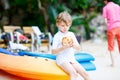 Little kid boy drinking coconut juice on tropical beach Royalty Free Stock Photo