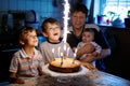 Little kid boy and family, father, brother and baby sister celebrating birthday Royalty Free Stock Photo