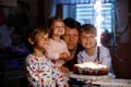Little kid boy and family, father, brother and baby sister celebrating birthday Royalty Free Stock Photo