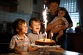 Little kid boy and family, father, brother and baby sister celebrating birthday Royalty Free Stock Photo