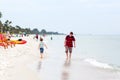 Little kid boy and father having fun with collecting shells Royalty Free Stock Photo