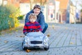 Little kid boy and father playing with car, outdoors Royalty Free Stock Photo