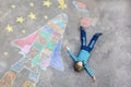 Little kid boy flying by a space shuttle chalks picture Royalty Free Stock Photo