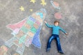 Little kid boy flying by a space shuttle chalks picture