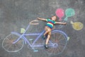 Little kid boy having fun with bike chalks picture Royalty Free Stock Photo