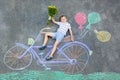 Little kid boy having fun with bike chalks picture Royalty Free Stock Photo