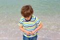 Little kid boy having fun with collecting shells Royalty Free Stock Photo