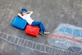 Little kid boy having fun with fast train picture drawing with colorful chalks on asphalt Royalty Free Stock Photo