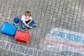 Little kid boy having fun with fast train picture drawing with colorful chalks on asphalt Royalty Free Stock Photo