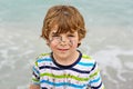 Little kid boy having fun on tropical beach Royalty Free Stock Photo