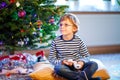 Little kid boy playing video game console on Christmas Royalty Free Stock Photo