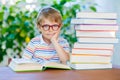 Little kid boy reading book at school Royalty Free Stock Photo