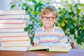 Little kid boy reading book at school Royalty Free Stock Photo