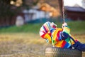 Little kid boy swinging on playground outdoors Royalty Free Stock Photo