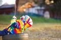 Little kid boy swinging on playground outdoors Royalty Free Stock Photo