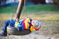 Little kid boy swinging on playground outdoors Royalty Free Stock Photo