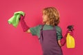 Little kid cleaning at home. Child doing housework having fun. Studio isoalted portrait of child housekeeper with wet