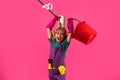 Little kid cleaning at home. Child doing housework having fun. Studio isoalted portrait of child housekeeper with wet