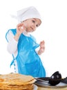 Little kid cooking pancakes