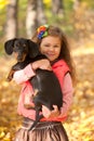 Little kid with dachshund puppy. Royalty Free Stock Photo