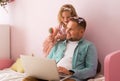 Little kid daughter playing with dad making hair style and makeup. Parent on home isolation because of covid 19. Child Royalty Free Stock Photo