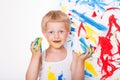 Little kid draws bright colors. School. Preschool. Education. Creativity. Studio portrait over white background Royalty Free Stock Photo