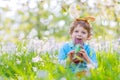 Little kid with Easter bunny ears and chocolate Royalty Free Stock Photo