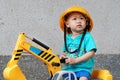 Little kid on the excavator toy
