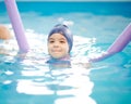 Little kid float on swimming pool Royalty Free Stock Photo