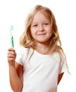 A little kid girl is brushing her teeth with a toothbrush. The concept of daily hygiene. Isolated on white background Royalty Free Stock Photo