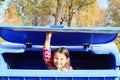 Little kid - girl hiding in a container Royalty Free Stock Photo