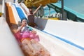 Little kid girl sliding down on water slide Royalty Free Stock Photo