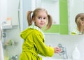 Little girl washing her hands in the bathroom Royalty Free Stock Photo