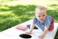Little kid playing cornhole in summer Royalty Free Stock Photo