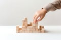 Little kid playing wooden toys on white background.