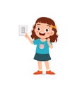 little kid press electric power switch on the wall Royalty Free Stock Photo