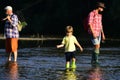 Little kid pulling fishing rod while fishing on weekend. Little fisherman ready to go fishing. Cute boy is fishing in