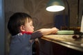 Little kid turning off the light Royalty Free Stock Photo