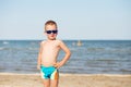 Little kid wearing fashion sunglasses on the beach Royalty Free Stock Photo