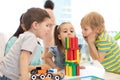 Little kids build block toys at home or daycare. Emotional kids playing with color blocks. Educational toys for Royalty Free Stock Photo