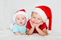 Little kids with christmas hats