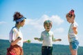 Little kids with colorful paint. Group of children enjoying playing with colored powder and color dust splash.