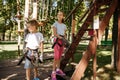 Little kids in equipment, rope park, playground Royalty Free Stock Photo