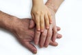 Little kids grandson hands on old hands of grandparents. Concept assistance, patronage and generation. National Senior Citizens Royalty Free Stock Photo