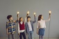 Little kids holding glowing light bulbs as metaphor for pursuing their own creative ideas Royalty Free Stock Photo
