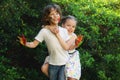 Little kids hugging, their faces and hands are colored Royalty Free Stock Photo